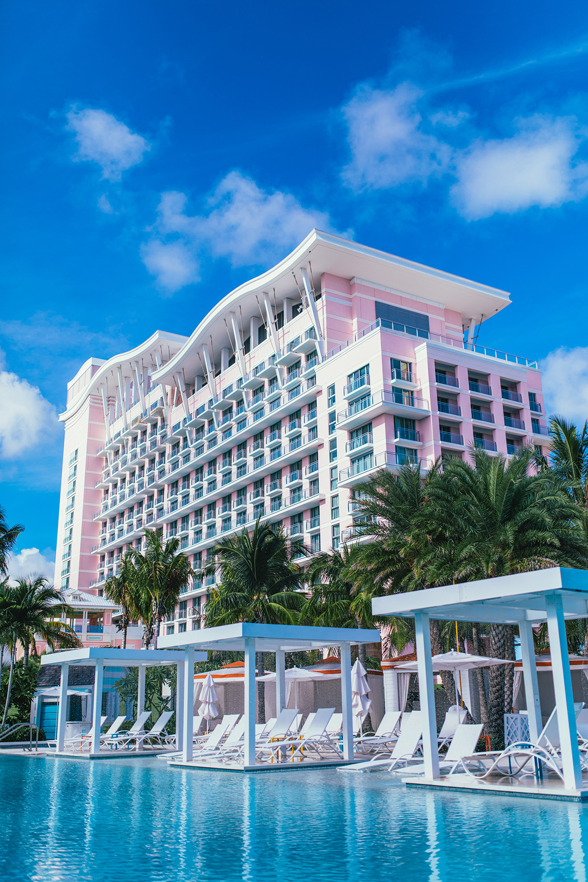 Exterior of luxury beach-front hotel with pink facade 