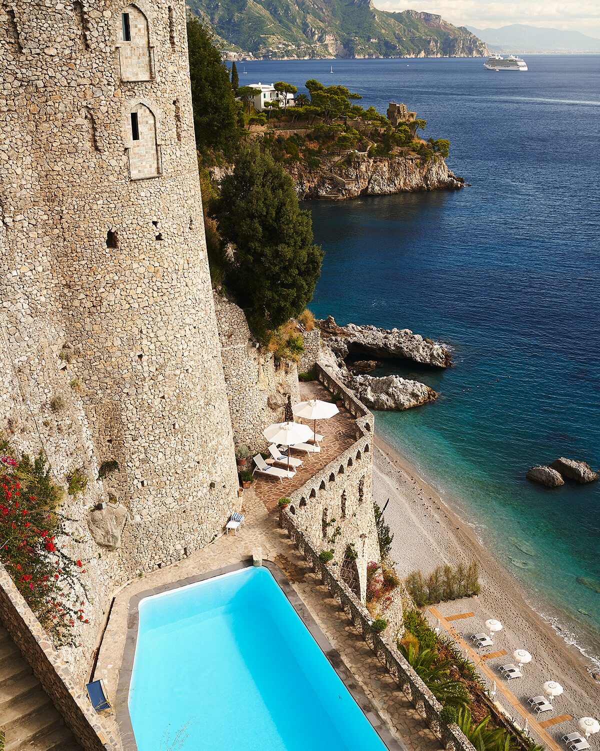 A private beach, a pool, and ancient buildings look out onto the Amalfi Coast 